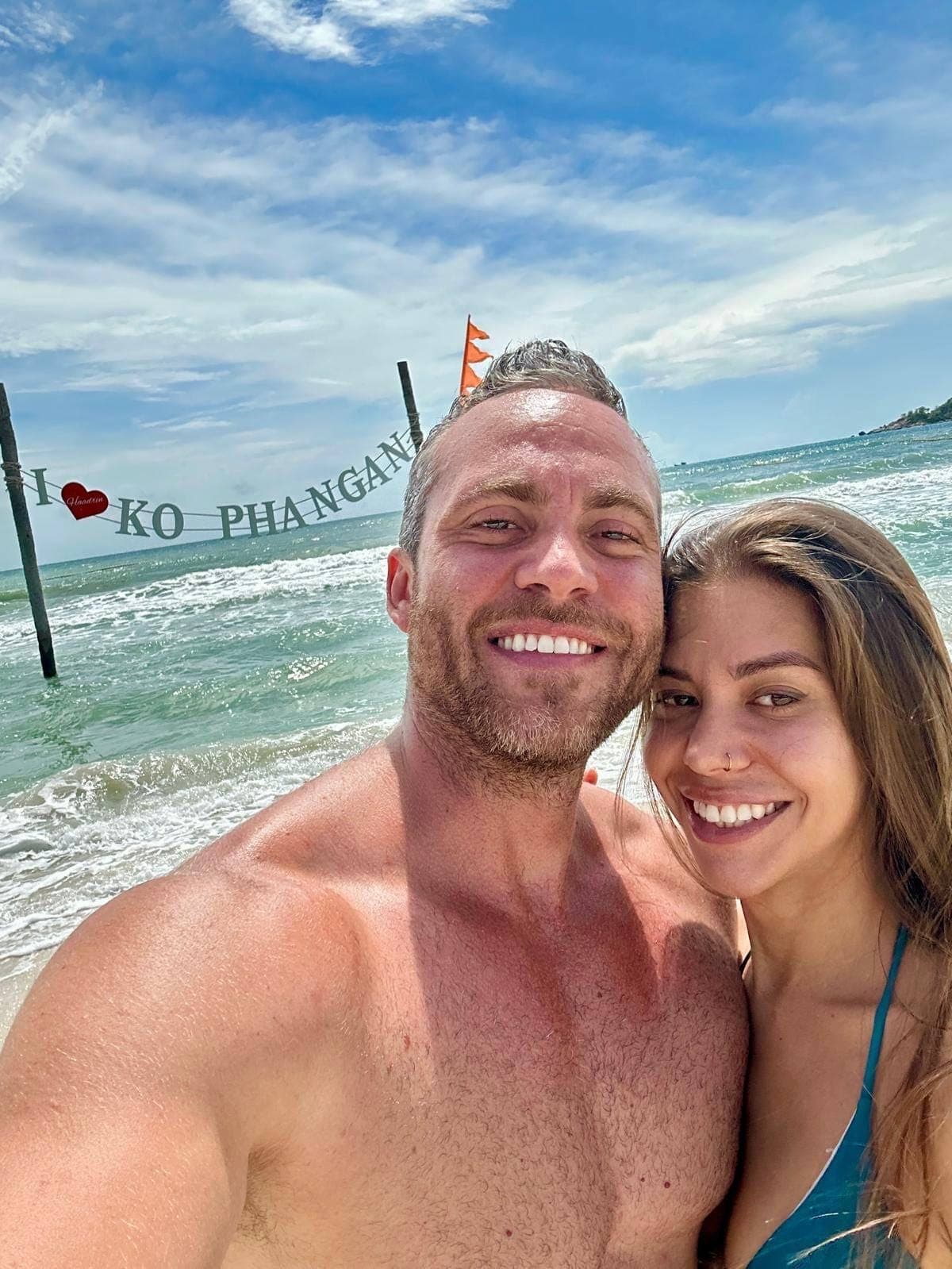 Luca & Albina on the beach by the I love Ko Phangan sign