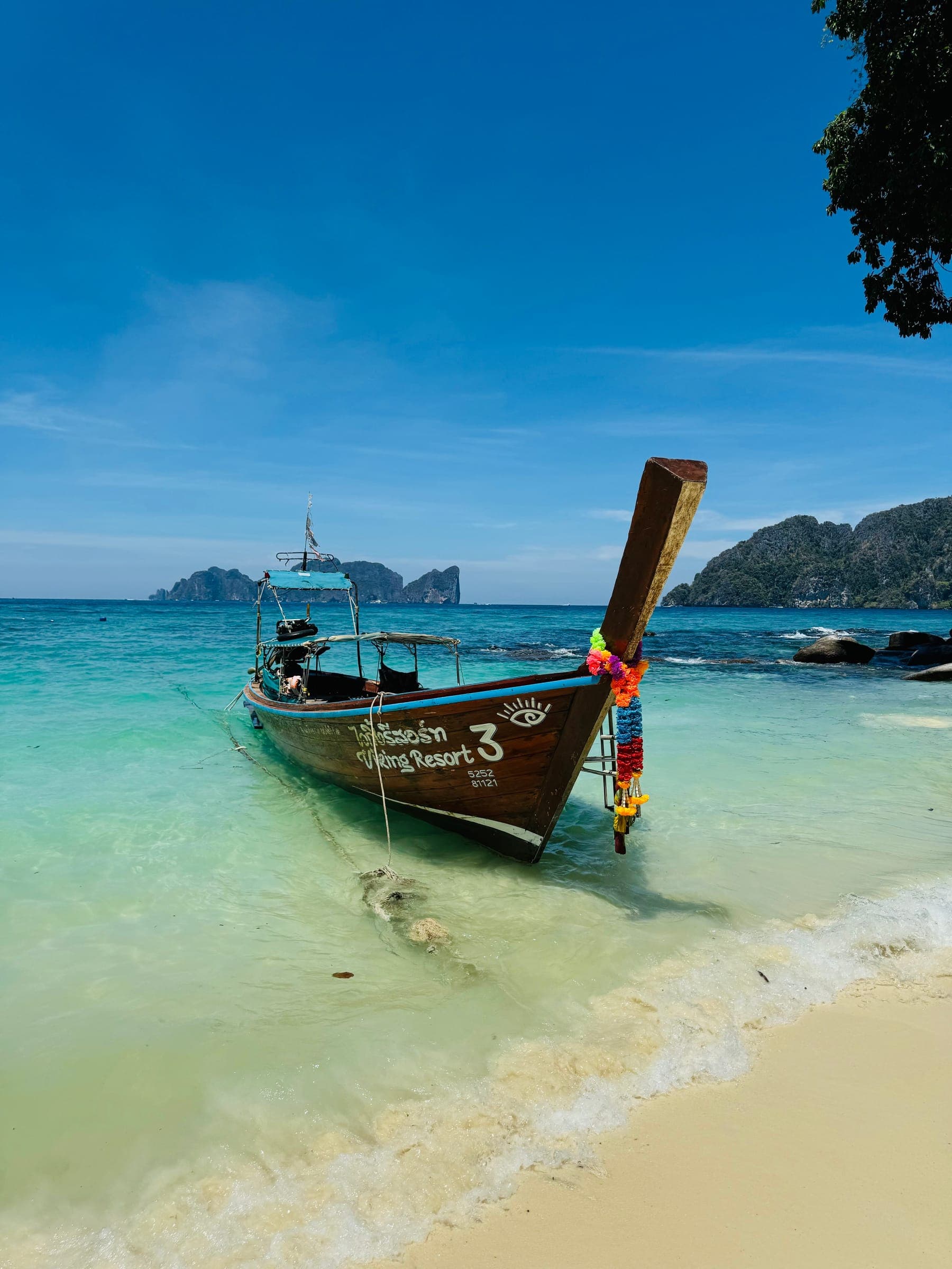 Longtail boat on turquoise water