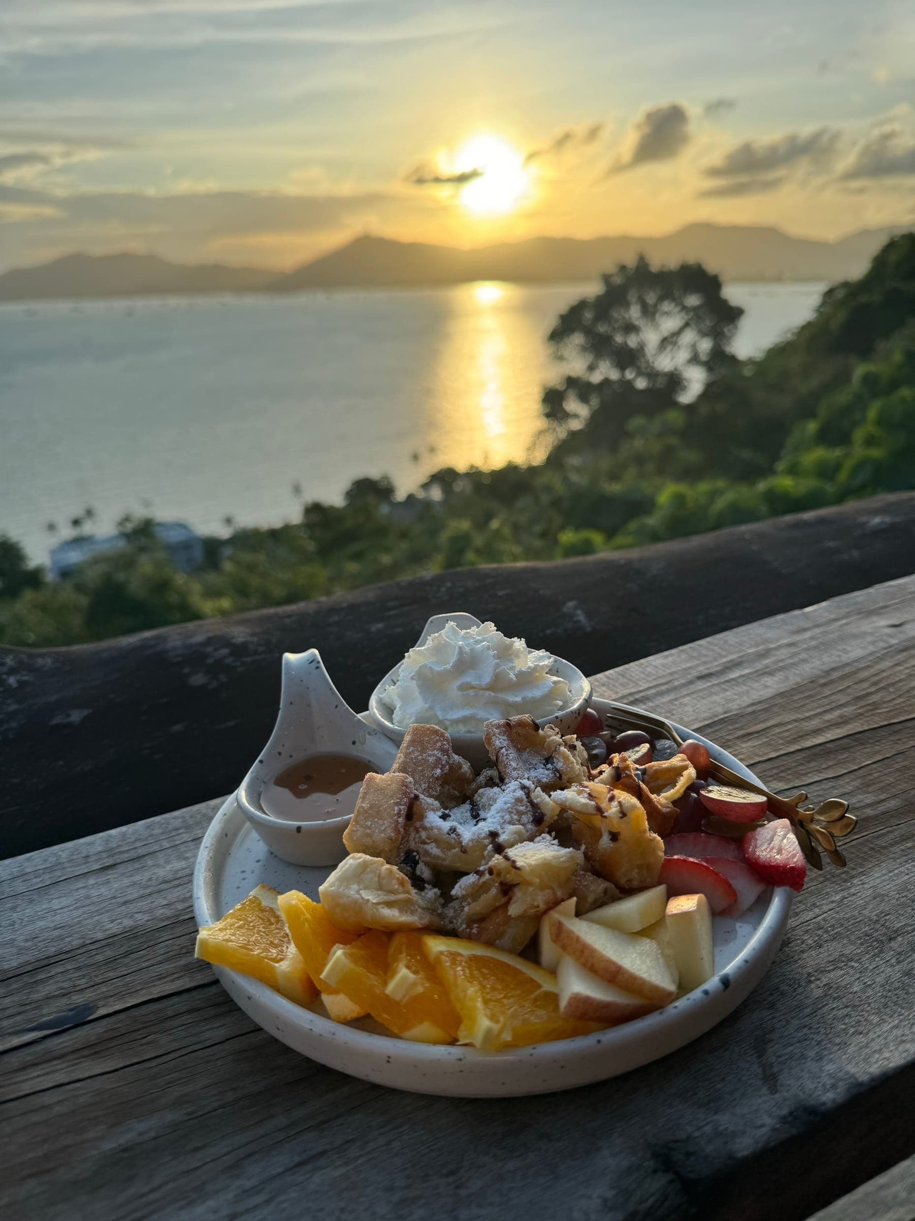 Sunset over the sea from a hilltop café